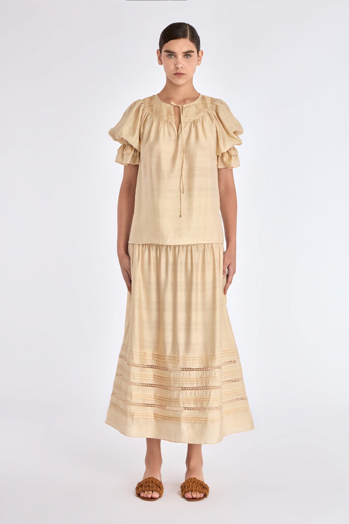 Front view of the Lauren Blouse in Vanilla, showcasing its adjustable V-slit neckline.