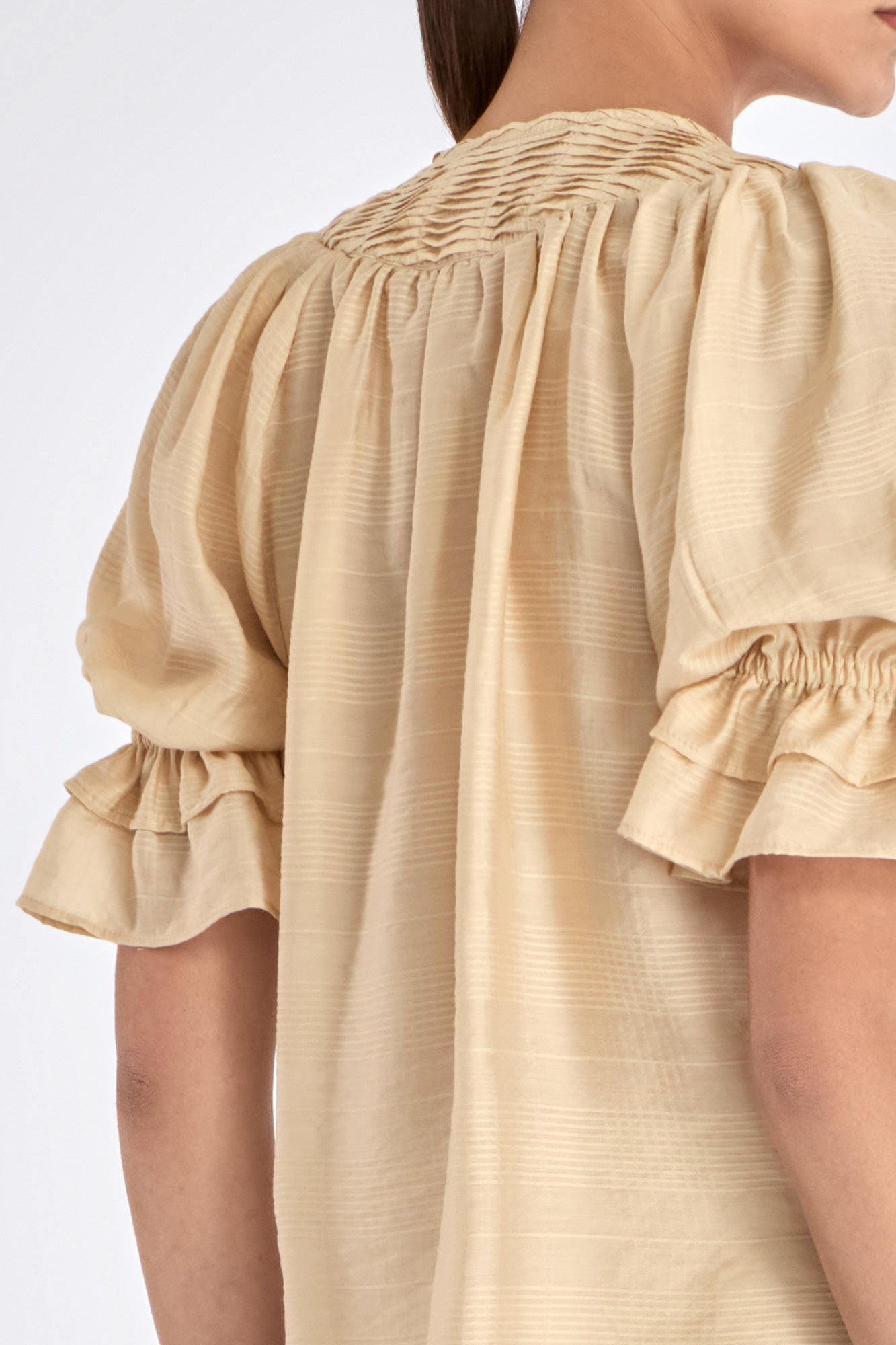 Front view of the Lauren Blouse in Vanilla, showcasing its adjustable V-slit neckline.