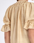 Front view of the Lauren Blouse in Vanilla, showcasing its adjustable V-slit neckline.