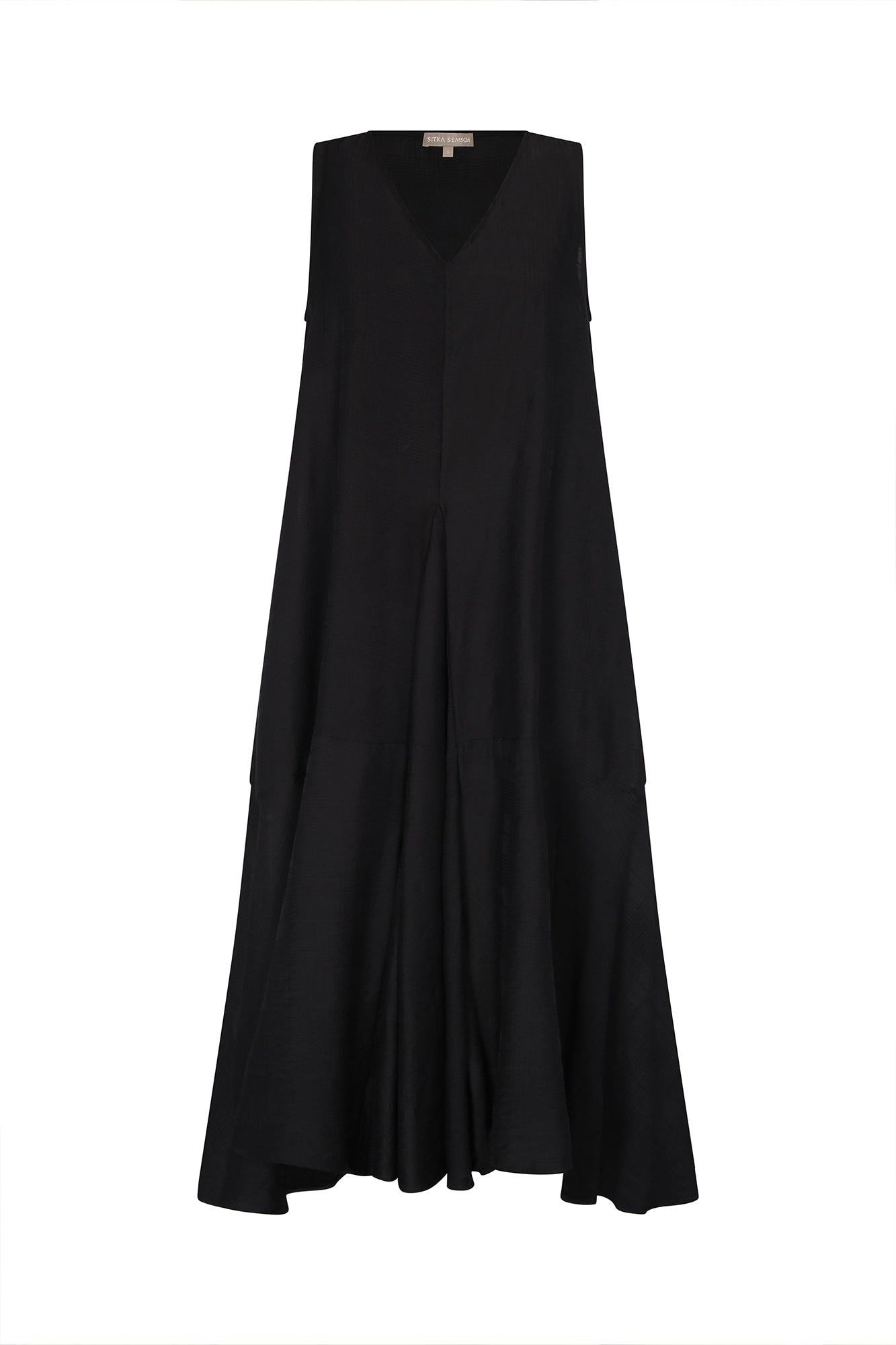 The Lenox Dress in black, styled to showcase its elegant V-neck and voluminous godet skirt.