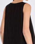 Clean back view of the essential black Lenox Godet Dress.