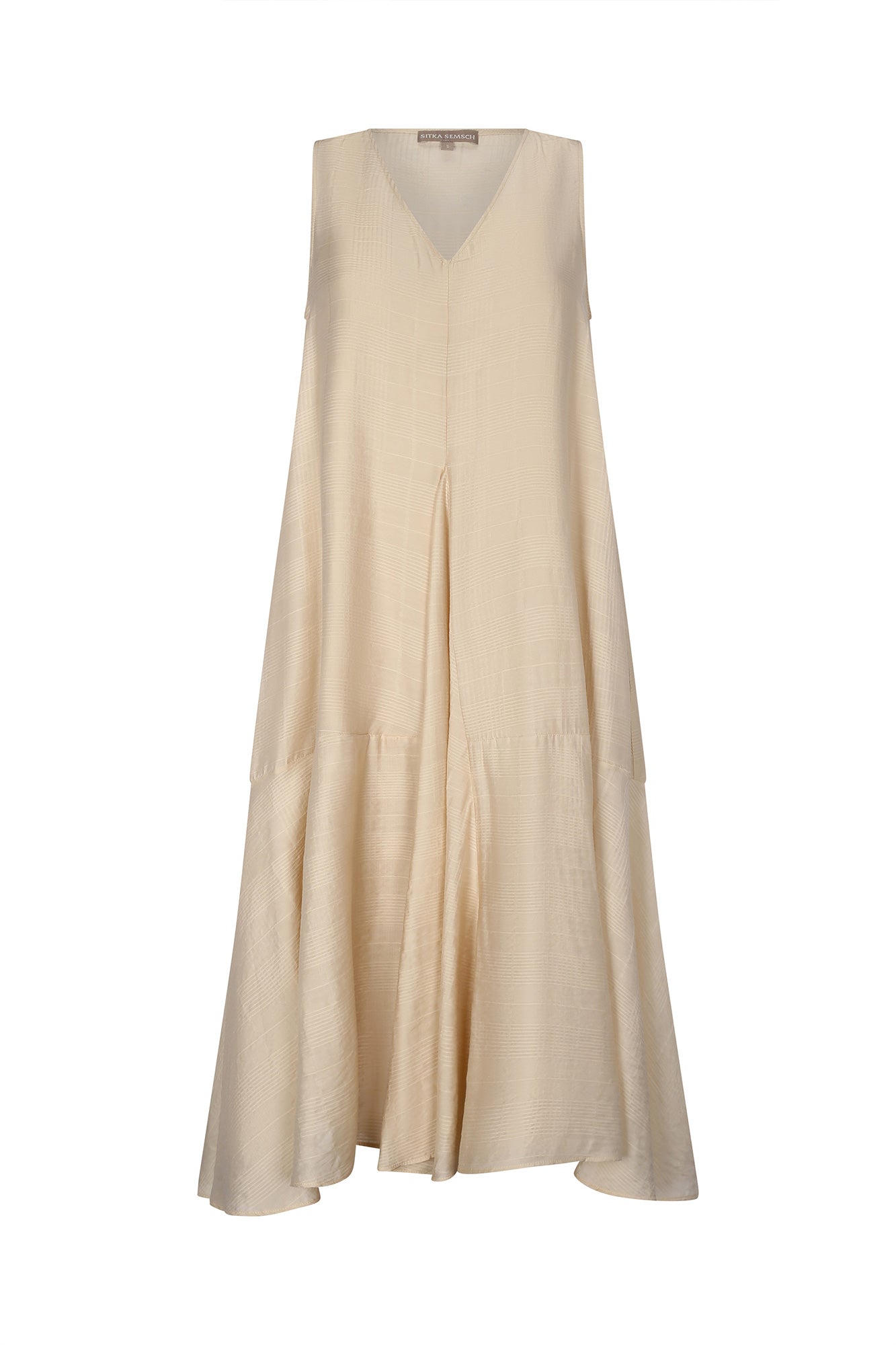 Front view of the Lenox Dress in Vanilla, showcasing its V-neckline and flowing godet skirt.
