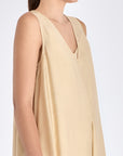 Side profile of the Vanilla Lenox Dress, highlighting the graceful movement and flare of the godet construction.