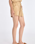 Lira Short in Camel – Linen mid-rise shorts with patch pockets, belt with metal tips, and tone-on-tone trims.