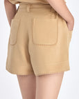 Lira Short in Camel – Linen mid-rise shorts with patch pockets, belt with metal tips, and tone-on-tone trims.