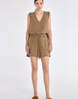 Lira Short in Taupe – Chic mid-rise linen shorts with elasticated waistband, metal-tipped belt, and patch pocket detailing.