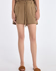 Lira Short in Taupe – Chic mid-rise linen shorts with elasticated waistband, metal-tipped belt, and patch pocket detailing.