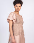 Liz Top in Blush – Handwoven crochet top with beaded embroidery and open-back design.