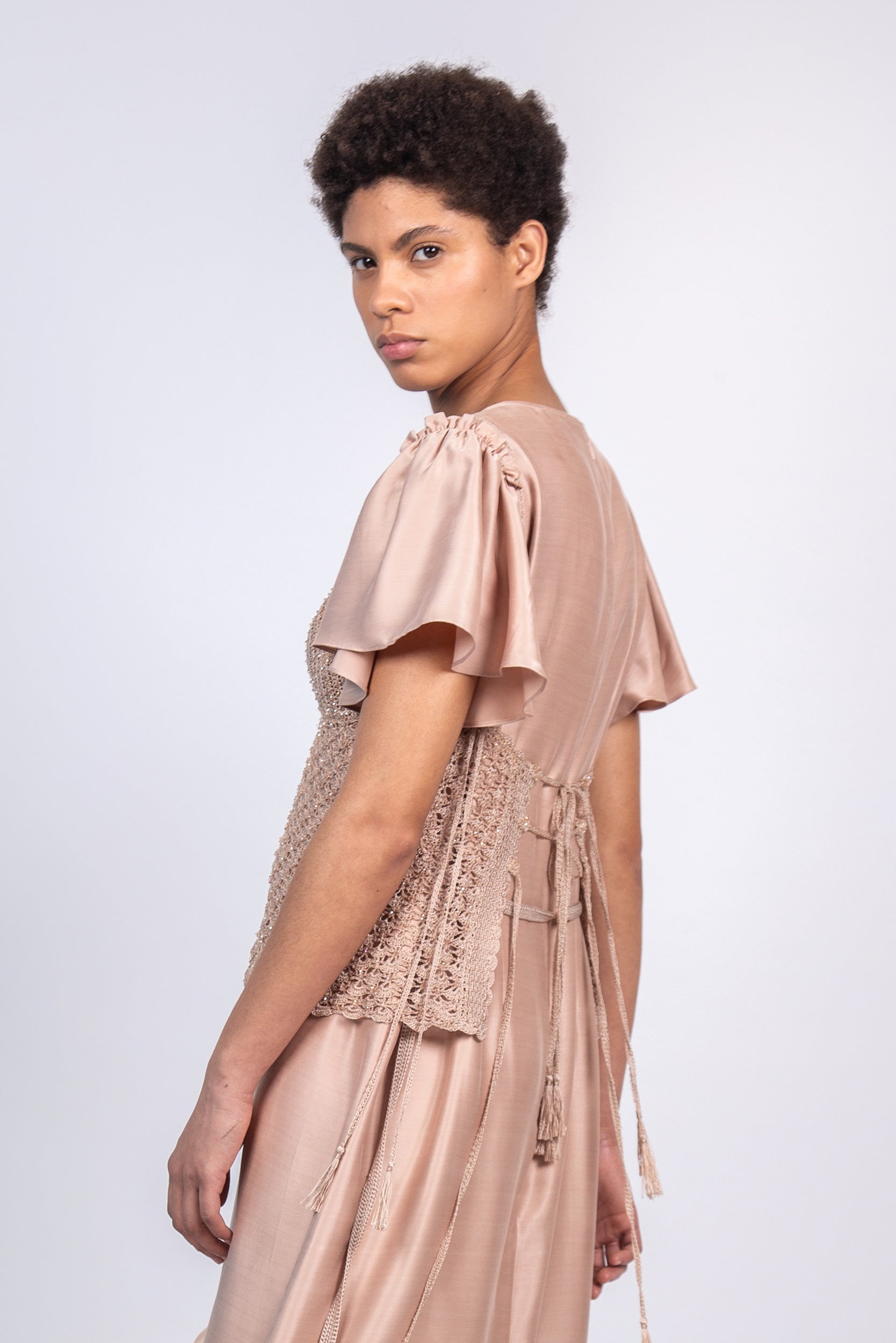 Liz Top in Blush – Handwoven crochet top with beaded embroidery and open-back design.