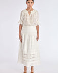 Model wearing the Luanda High-Waist Skirt in Off White.