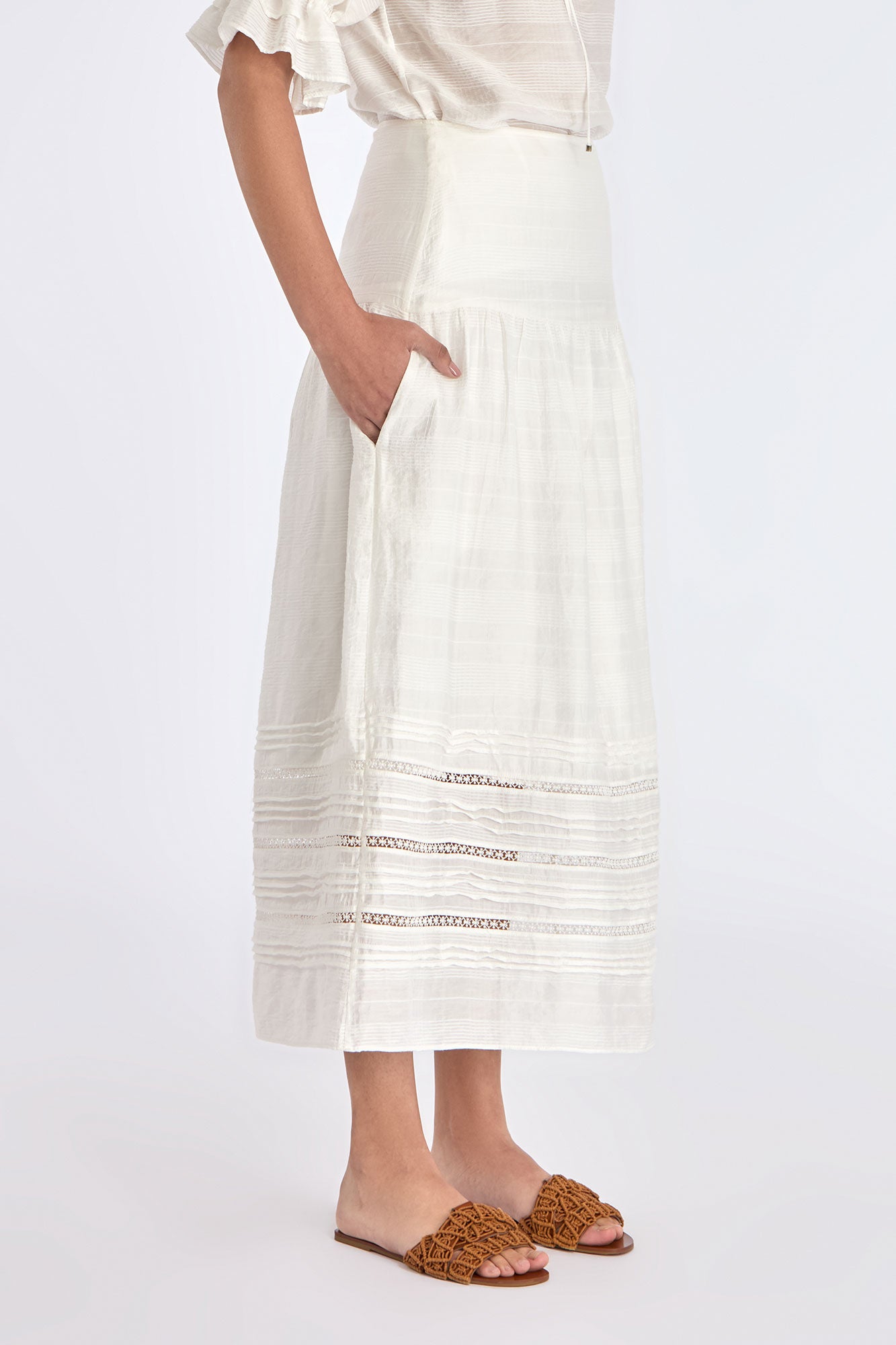 The Off White Luanda Skirt shown in profile to highlight its fluid, gathered silhouette.