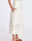 The Off White Luanda Skirt shown in profile to highlight its fluid, gathered silhouette.