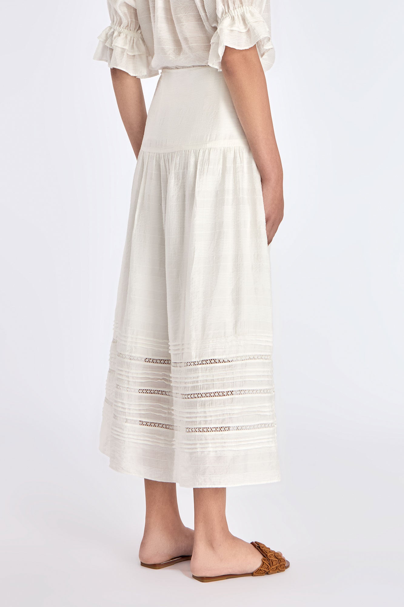 Back of the Luanda Skirt, showcasing the smooth high waistband and invisible zipper detail.