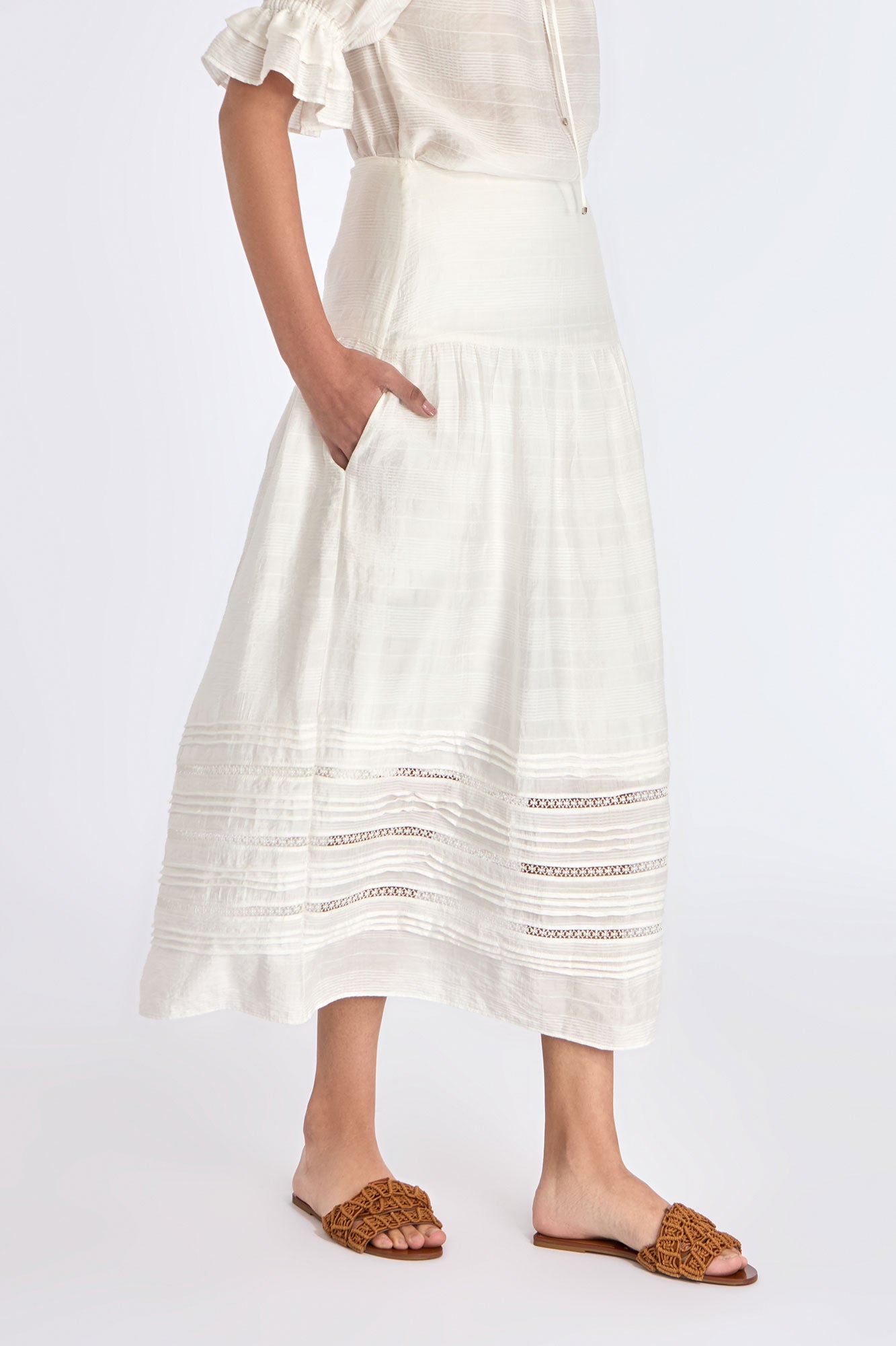 The Off White Luanda Skirt shown in profile to highlight its fluid, gathered silhouette.