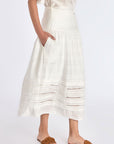 The Off White Luanda Skirt shown in profile to highlight its fluid, gathered silhouette.