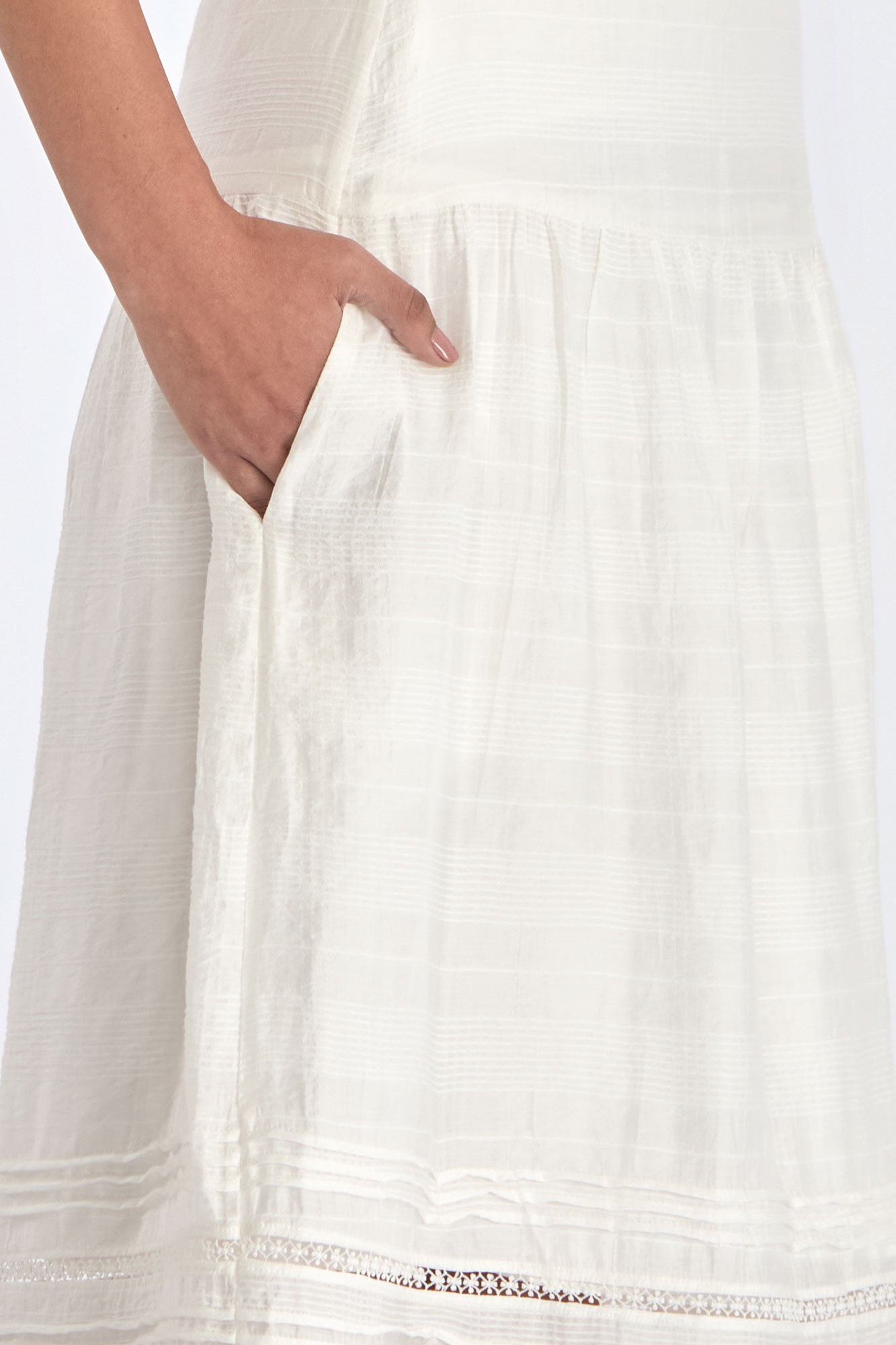 lose-up of the woven texture and tonal hem trim on the Off White Luanda Skirt.