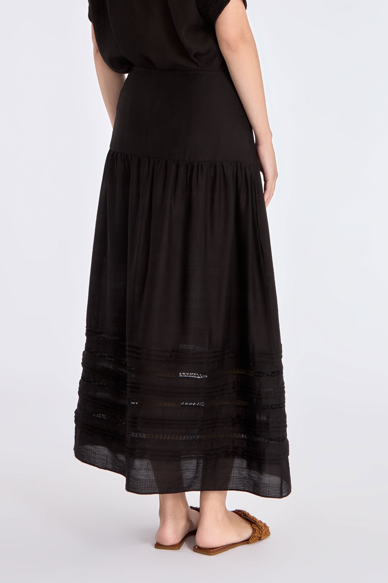 Clean back silhouette of the Luanda High-Waist Skirt in black.