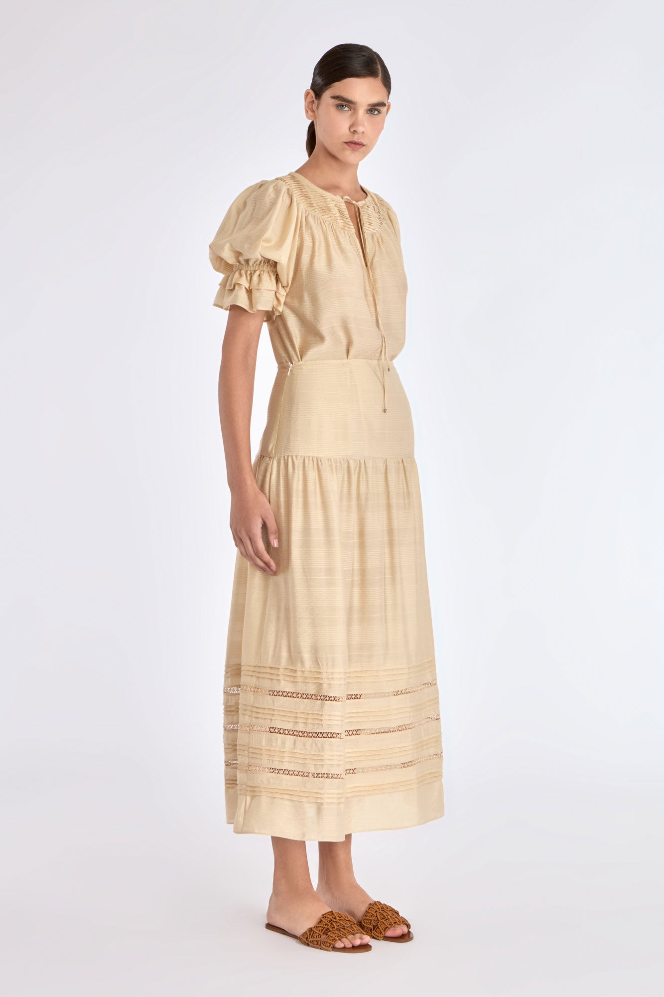 Front view of the Luanda Skirt in Vanilla, showcasing its high-waist and fluid midi silhouette.