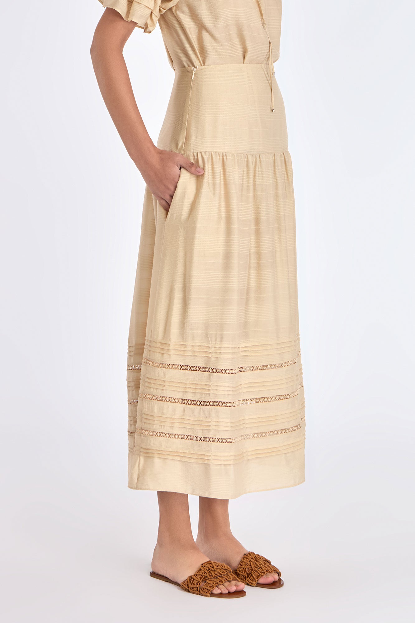 Side profile of the Vanilla Luanda Skirt, highlighting the graceful drape and gathered yoke detail.