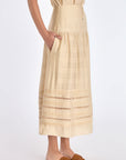 Side profile of the Vanilla Luanda Skirt, highlighting the graceful drape and gathered yoke detail.