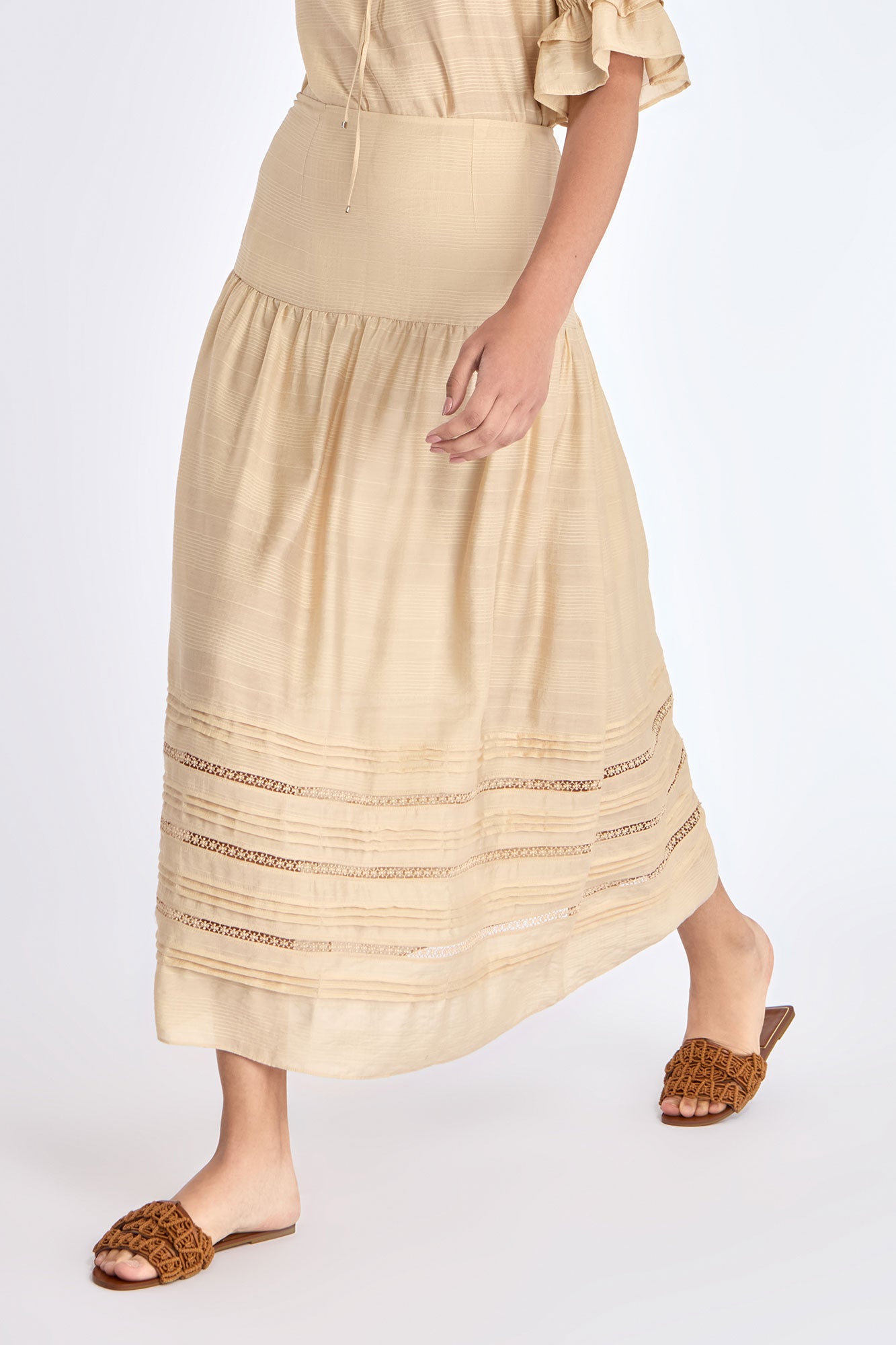 Front view of the Luanda Skirt in Vanilla, showcasing its high-waist and fluid midi silhouette.