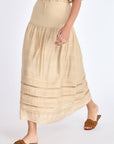 Front view of the Luanda Skirt in Vanilla, showcasing its high-waist and fluid midi silhouette.