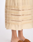 Close-up of the tonal trim and stitching detail on the hem of the Vanilla Luanda Skirt