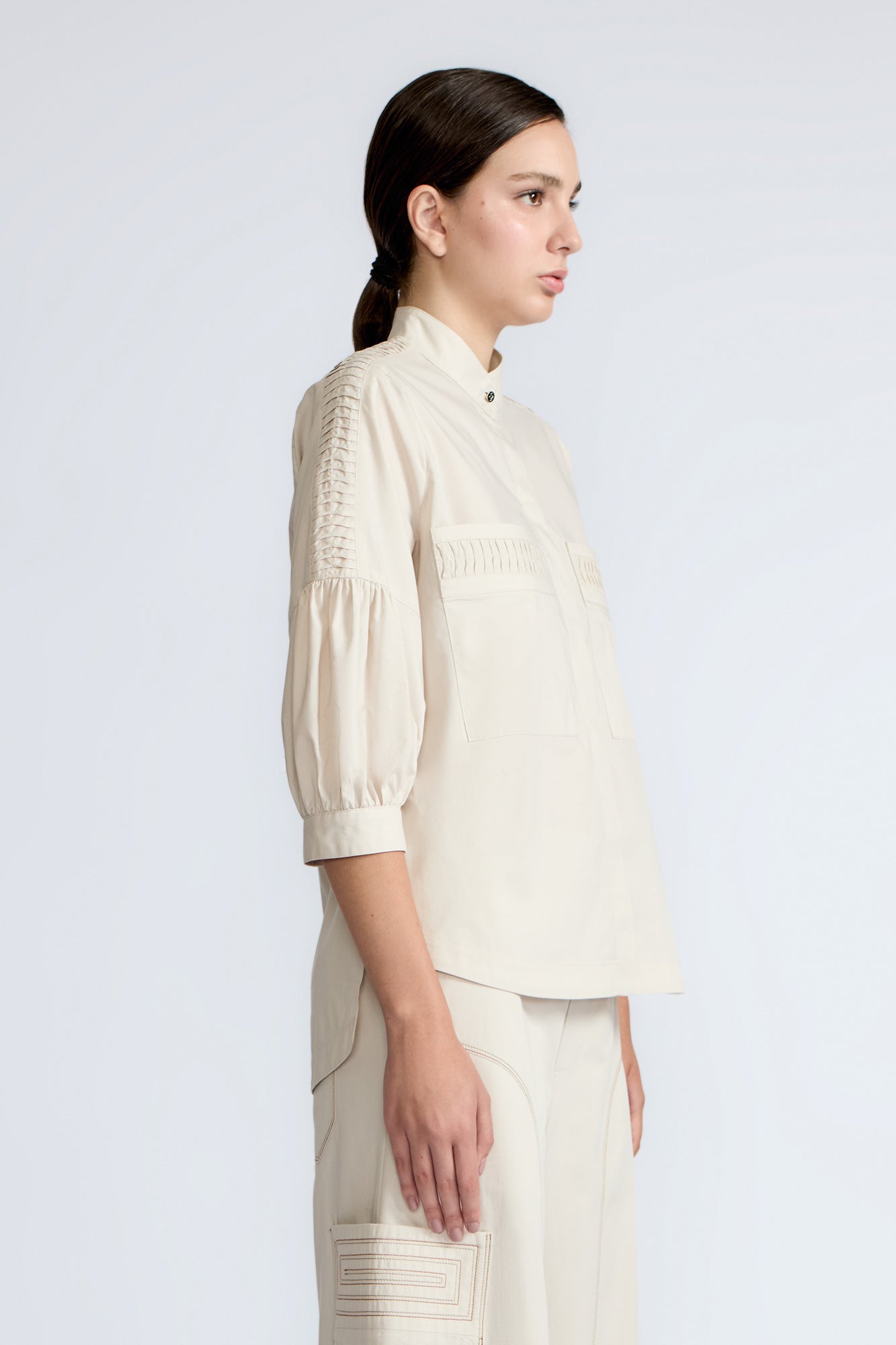 Magali Blouse in Prestine – Pima cotton blouse with Neru collar, hidden front buttons, patch pockets, and ¾ sleeves with semi-elastic cuffs.