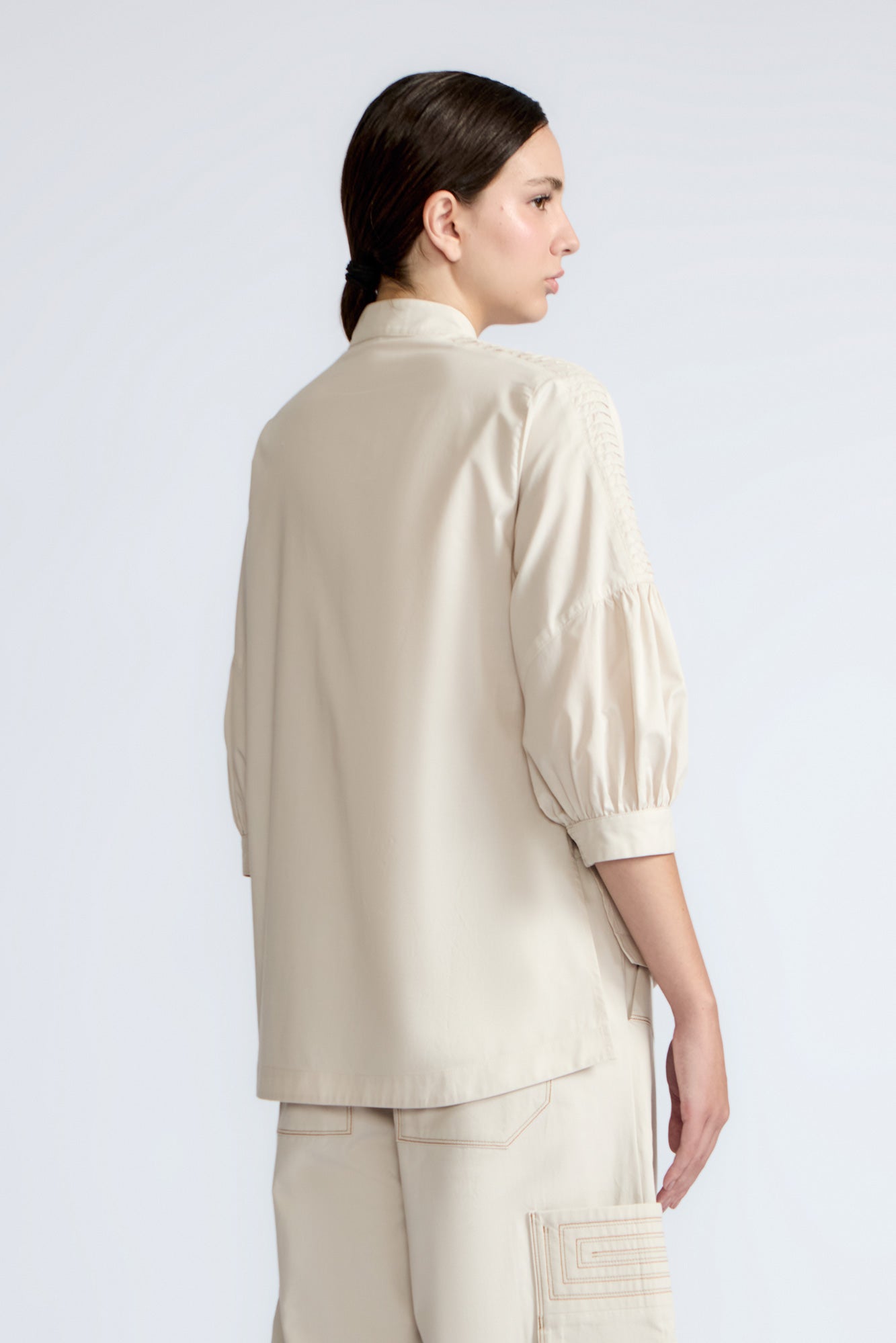 Magali Blouse in Prestine – Pima cotton blouse with Neru collar, hidden front buttons, patch pockets, and ¾ sleeves with semi-elastic cuffs.