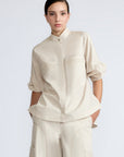 Magali Blouse in Prestine – Pima cotton blouse with Neru collar, hidden front buttons, patch pockets, and ¾ sleeves with semi-elastic cuffs.