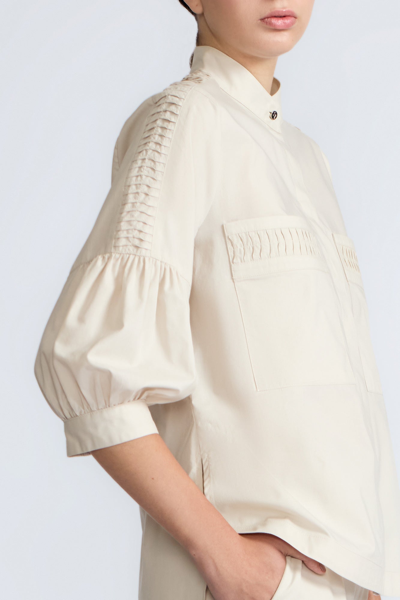 Magali Blouse in Prestine – Pima cotton blouse with Neru collar, hidden front buttons, patch pockets, and ¾ sleeves with semi-elastic cuffs.