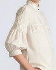 Magali Blouse in Prestine – Pima cotton blouse with Neru collar, hidden front buttons, patch pockets, and ¾ sleeves with semi-elastic cuffs.
