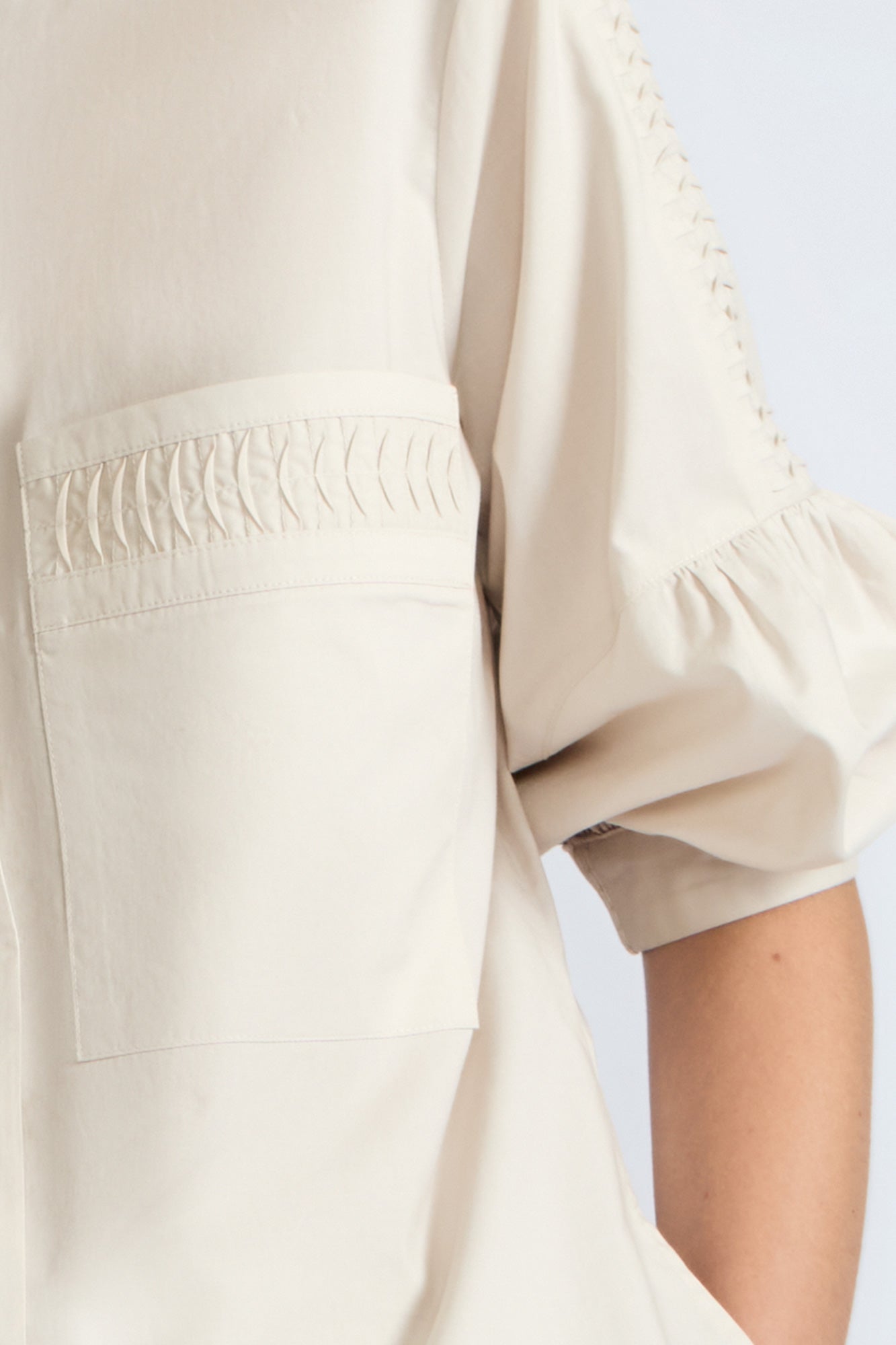 Magali Blouse in Prestine – Pima cotton blouse with Neru collar, hidden front buttons, patch pockets, and ¾ sleeves with semi-elastic cuffs.