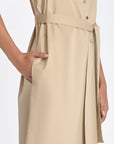 Side silhouette of the Ecru Maki Dress, showcasing its midi length and clean lines.