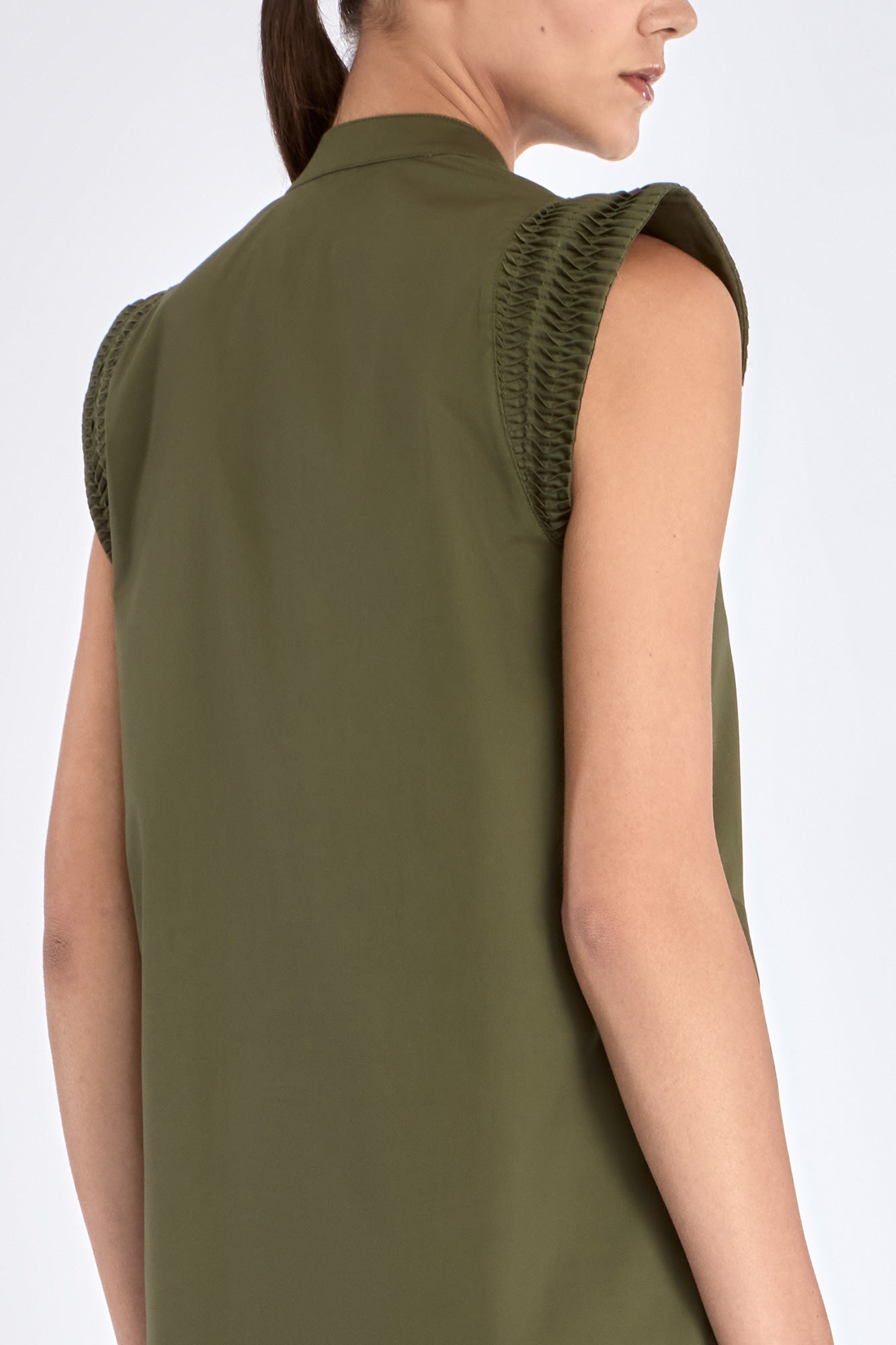 Back view of the Maki Dress, showing the elegant drape of the stretch cotton fabric.