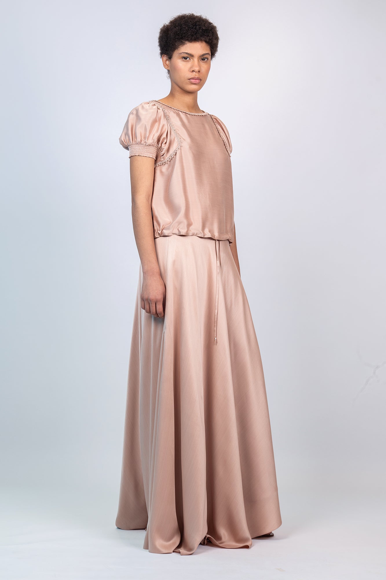 Mariani Skirt in Blush – Flowing asymmetrical silk maxi skirt with wide waistband.