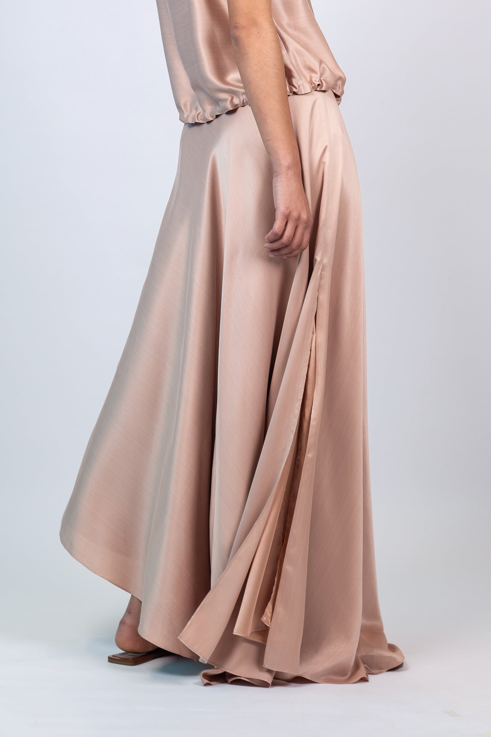 Mariani Skirt in Blush – Flowing asymmetrical silk maxi skirt with wide waistband.