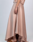 Mariani Skirt in Blush – Flowing asymmetrical silk maxi skirt with wide waistband.