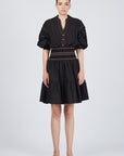 Mercy Cotton Mini Dress with pleated ruffled skirt and elasticated belt in blue and black