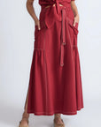 Model wearing the long Milena Maxi Skirt in a rich wine color.