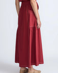 Detail of the adjustable waistband with metal toppers on the Milena Skirt.