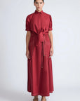 Model wearing the long Milena Maxi Skirt in a rich wine color.