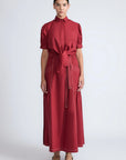 Model wearing the long Milena Maxi Skirt in a rich wine color.