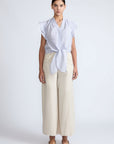 Oriana Blouse in Light Blue Stripes – Cotton blouse with V-neck, Neru collar, ruffled sleeves, appliqué trim, and tie-front hem.
