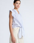 Oriana Blouse in Light Blue Stripes – Cotton blouse with V-neck, Neru collar, ruffled sleeves, appliqué trim, and tie-front hem.