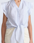 Oriana Blouse in Light Blue Stripes – Cotton blouse with V-neck, Neru collar, ruffled sleeves, appliqué trim, and tie-front hem.