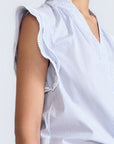 Oriana Blouse in Light Blue Stripes – Cotton blouse with V-neck, Neru collar, ruffled sleeves, appliqué trim, and tie-front hem.