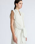 Oriana Blouse in Silver – Cotton blouse with V-neckline, Neru collar, ruffled sleeve details, tie hem, and appliqué embellishment.