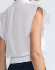Oriana Blouse in White – Elegant cotton blouse with V-neck, Neru collar, ruffle sleeves, tie waist, and hand-appliqué detailing.