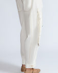 Paloma Pant in Off White – Relaxed cotton pants with patch pockets, contrast stitching, and side ties for a chic silhouette.